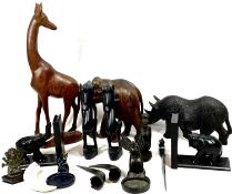 EBONY & OTHER WOODS ETHNIC CARVINGS and collectables to include a 14cms H, 35cms L rhinoceros, ebony