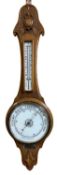 CARVED OAK ANEROID BAROMETER WITH THERMOMETER - 86cms L