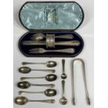 CATTANEO & CO LEEDS - a cased four piece silver set of knife, fork, spoon and napkin ring by