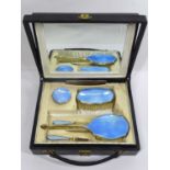 SILVER & GUILLOCHE ENAMEL SEVEN PIECE VANITY TRAVEL SET, Birmingham 1927, in original fitted case,