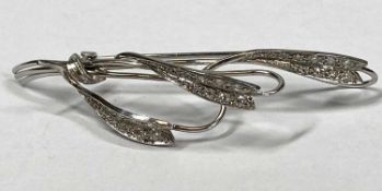 18CT WHITE GOLD & DIAMOND LEAF BROOCH - set with 27 small diamonds, 6.8grms, 20th century, 6.25cms