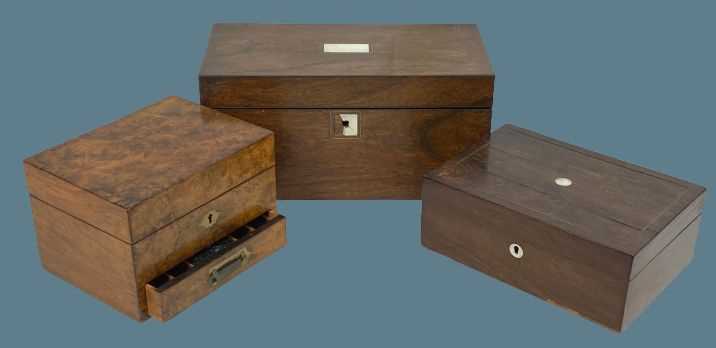 THREE VINTAGE LIDDED BOXES - a burr walnut jewellery box with lower front drawer and inset brass