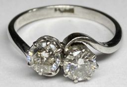 PLATINUM TWO STONE CROSSOVER DIAMOND RING - the stones 0.50ct each, colour near white, some small