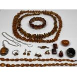 SUITE OF AMBER JEWELLERY & AMBER TYPE - 14 items to include three Baltic amber necklaces and