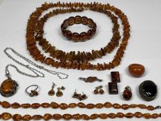 SUITE OF AMBER JEWELLERY & AMBER TYPE - 14 items to include three Baltic amber necklaces and