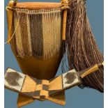 AFRICAN ANIMAL SKIN BONGO DRUM, folding seat and a grass skirt, 48cms H the drum, 56cms across the