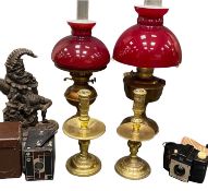 PERIOD BRASS CANDLESTICKS, a near pair with drip trays, 25.5cms H, two brass based oil lamps with