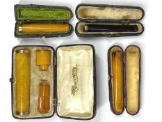 9CT GOLD, GILT METAL & OTHER AMBER CHEROOT HOLDERS (4), the two smaller having 9ct gold stamped