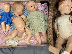 VINTAGE BISQUE/COMPOSITION DOLLS (4) - in varying conditions along with a wicker crib, 50cms L the