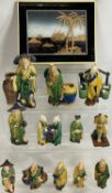 MODERN EASTERN CLAY POTTERY FIGURINES IN MAJOLICA TYPE GLAZES (2) and a framed cork picture of