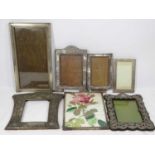 THREE PLAIN SILVER PHOTOGRAPH FRAMES and one other along with three base metal photograph frames,