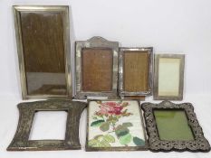 THREE PLAIN SILVER PHOTOGRAPH FRAMES and one other along with three base metal photograph frames,