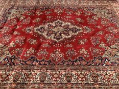 ANTIQUE EASTERN RUG - ground red with floral diamond central pattern and multi bordered edge, 350