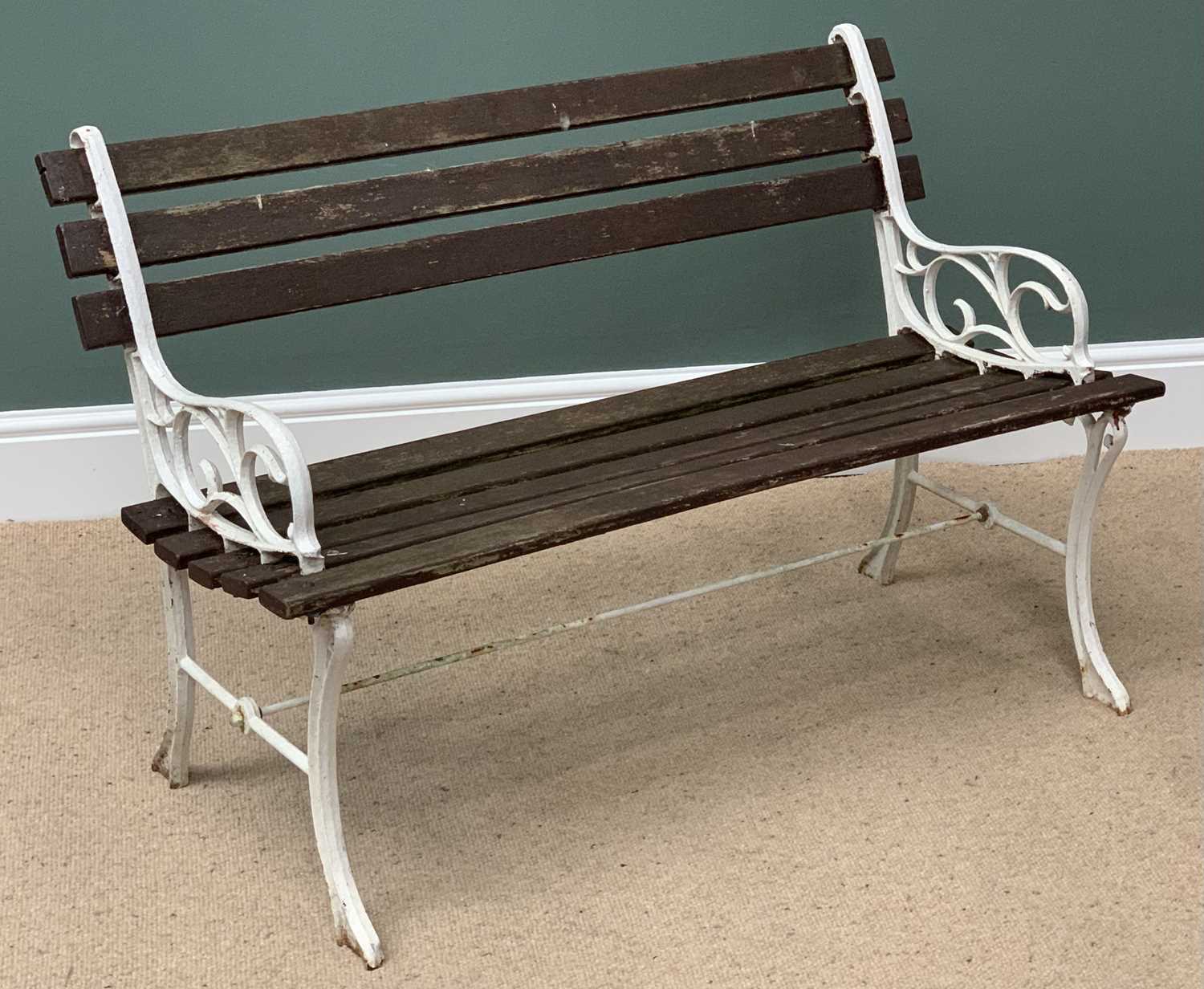 GARDEN BENCH with white painted cast metal ends and stretcher, the seat and back with wooden