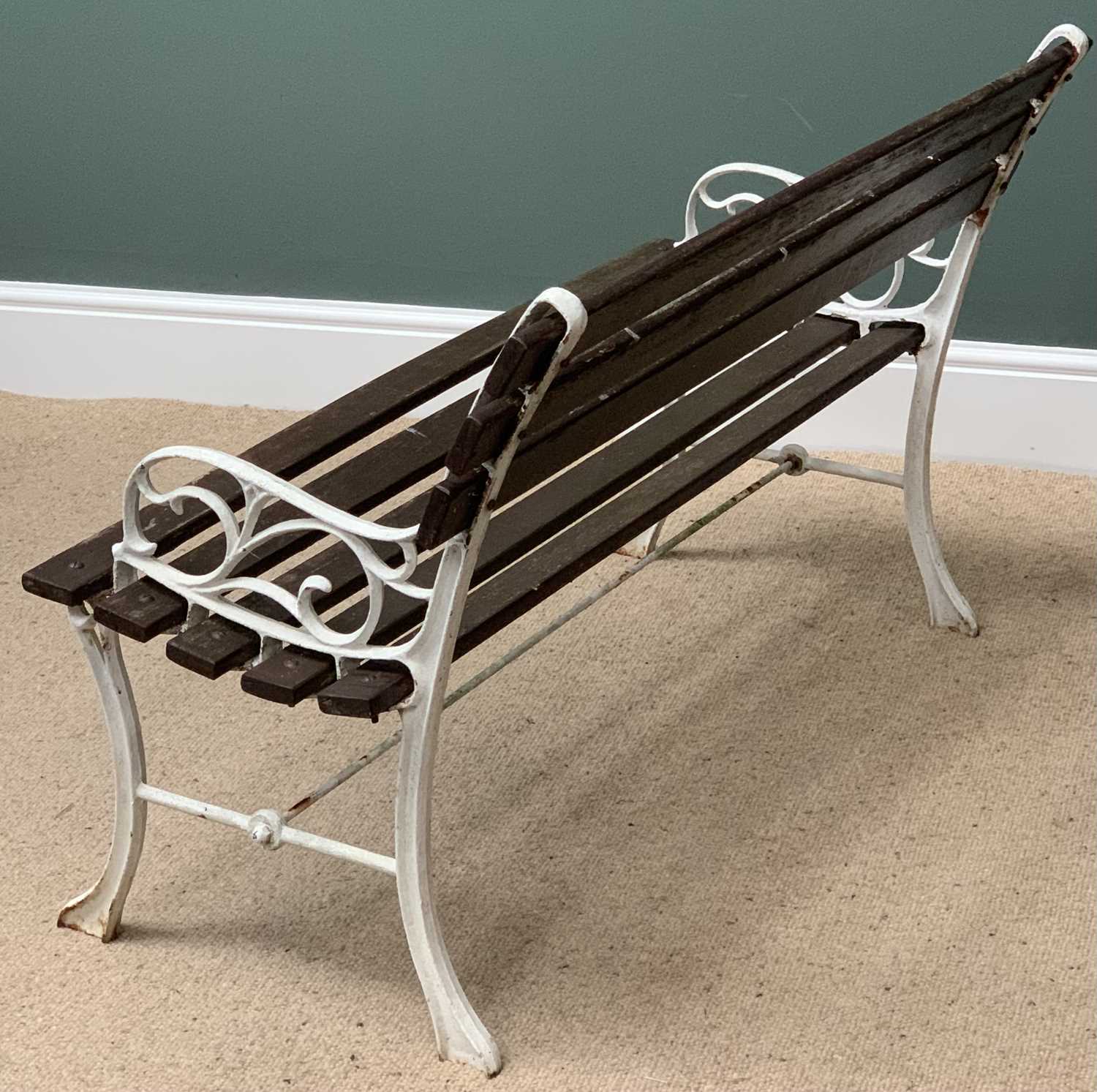 GARDEN BENCH with white painted cast metal ends and stretcher, the seat and back with wooden - Image 2 of 3
