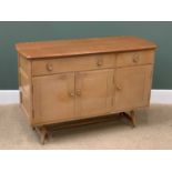 MID-CENTURY ERCOL SIDEBOARD, in light elm, having two drawers over three cupboard doors, 83cms H,