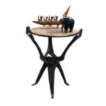 AFRICAN CARVED HARDWOOD FOLDING TABLE, ebony elephant and a South Seas type model of a boat