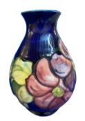 MOORCROFT CLEMATIS BULBOUS VASE - Cobalt ground impressed factory marks and signature along with