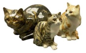 MIKE HINTON CERAMIC CATS WITH GLASS EYES (3) - signed to the bases, 17.5cms H, 30cms L the largest