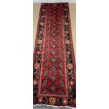 EASTERN RED GROUND RUNNER - central block with repeating pattern within a black border, hand