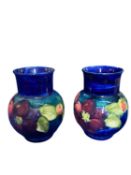MOORCROFT CLEMATIS BULBOUS VASES, A PAIR - decorated on a Cobalt ground, impressed factory marks