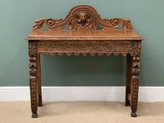 19TH CENTURY CARVED GOTHIC OAK STYLE TABLE - with central carved mask to the top rail, 103cms H,