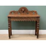 19TH CENTURY CARVED GOTHIC OAK STYLE TABLE - with central carved mask to the top rail, 103cms H,