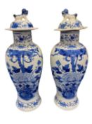 CHINESE BLUE & WHITE LIDDED VASES, A PAIR - Late 19th/early 20th. Prunus, peony and sparrows.