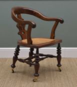 VICTORIAN WALNUT ARMCHAIR, curved back and arms above pierced splat, caned seat, turned legs tied by