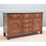 GEORGE III NORTH WALES OAK DRESSER BASE, probably Anglesey, fitted six drawers and two cupboards,