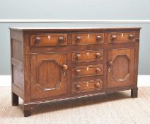 GEORGE III NORTH WALES OAK DRESSER BASE, probably Anglesey, fitted six drawers and two cupboards,