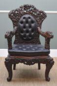 JAPANESE CARVED ARMCHAIR, c. 1900, decorated allover with chrysanthemum carving, button