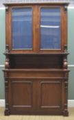 VICTORIAN WALNUT BOOKCASE, glazed upper doors between carved corbels and scrolled lower brackets (