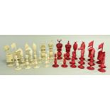 19TH CENTURY CHINESE 'BURMESE' PATTERN CARVED IVORY CHESS SET, stained red & natural with lobed