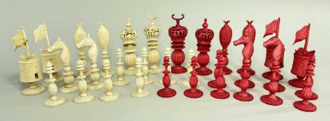 19TH CENTURY CHINESE 'BURMESE' PATTERN CARVED IVORY CHESS SET, stained red & natural with lobed