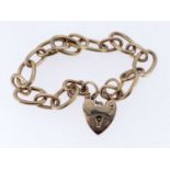 9CT YELLOW GOLD OVAL LINK BRACELET, having heart shaped padlock, 18.3gms Provenance: private