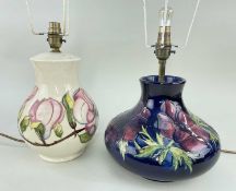 TWO MOORCROFT TABLE LAMPS, one anemone pattern on blue ground, the other magnolia pattern on cream