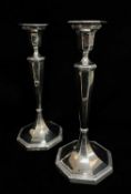 PAIR GEORGE V SILVER CANDLESTICKS, Sheffield 1927, of octagonal section, beaded rims, loded bases,