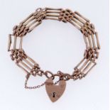 9CT GOLD FOUR BAR GATE BRACELET, having heart shaped padlock, 16.3gms Provenance: private collection