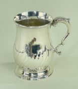 EDWARD VII SILVER BALUSTER TANKARD, Hunt & Roskell Ltd., London 1908, half wrythen fluted body, leaf