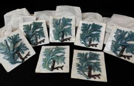 COLLECTION OF FAIENCE TILES, each moulded in relief with a leaf, 14 x 14cm (31)