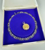 VICTORIAN 9CT GOLD FOB WATCH & SILVER NECKLACE, watch with floral chasing 29mm diam, the boxed fancy