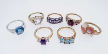 SEVEN MODERN 9K GOLD DRESS RINGS, set with various semi-precious gem stones, some stamped 'QVC',