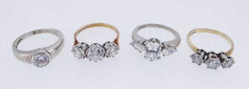 FOUR 9K GOLD CUBIC ZIRCONIA DRESS RINGS, 15.2gms gross (4) Provenance: private collection Gwynedd,