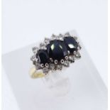 18CT GOLD SAPPHIRE & DIAMOND CLUSTER RING, the three central sapphires surrounded by sixteen