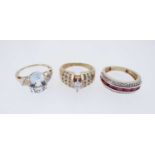 THREE MODERN 14K GOLD DRESS RINGS, comprising diamond and ruby triple row ring, diamond ring, and