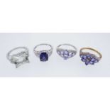 FOUR 9K GOLD DRESS RINGS, of various design set with diamond chips and semi-precious stones, 14.5gms