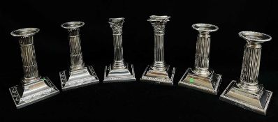 THREE PAIRS SILVER DWARF CANDLESTICKS, 1894-1923, with fluted, stop fluted and reeded columns,