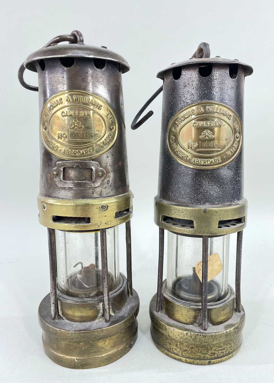 TWO THOMAS & WILLIAMS LTD. 'CAMBRIAN' MINER'S SAFETY LAMPS, consecutively numbered 144681 and