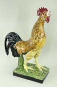 LARGE PORTUGESE POTTERY MODEL OF A COCKEREL, in majolica glazes, 52cms high, printed marks